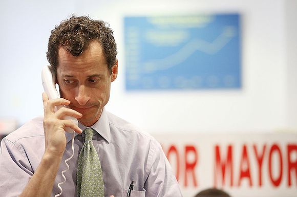 Weiner, seen here using a phone that he thankfully can't easily use to transmit a picture of his dick.